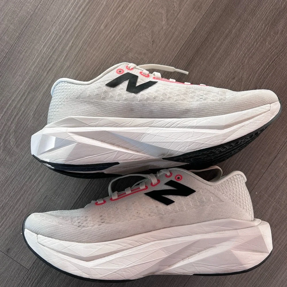 New Balance White Sneakers with Black Logo and Pink Accents